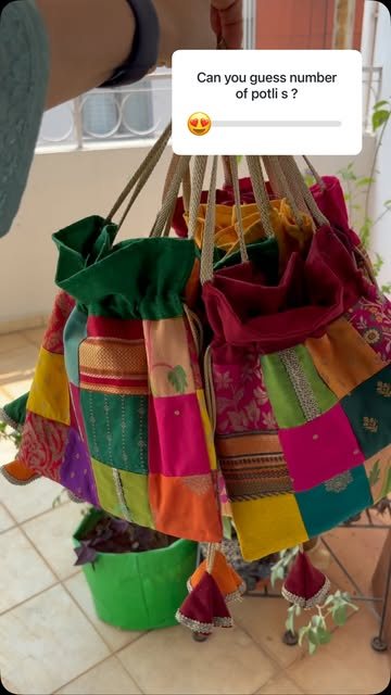 A bunch of patchwork potlis ready as return gifts